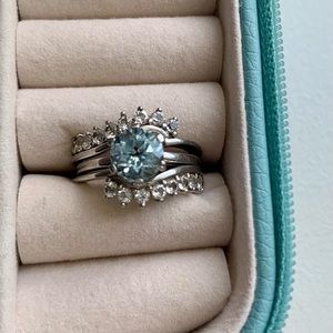 Light blue round cut stone solitaire with halo ring size 6